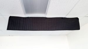 ceiling sound baffle in office acoustic treatment